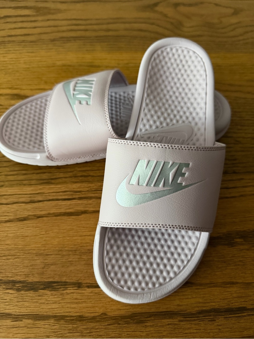 Nike Women's Light Pink Slides with Silver Swoosh